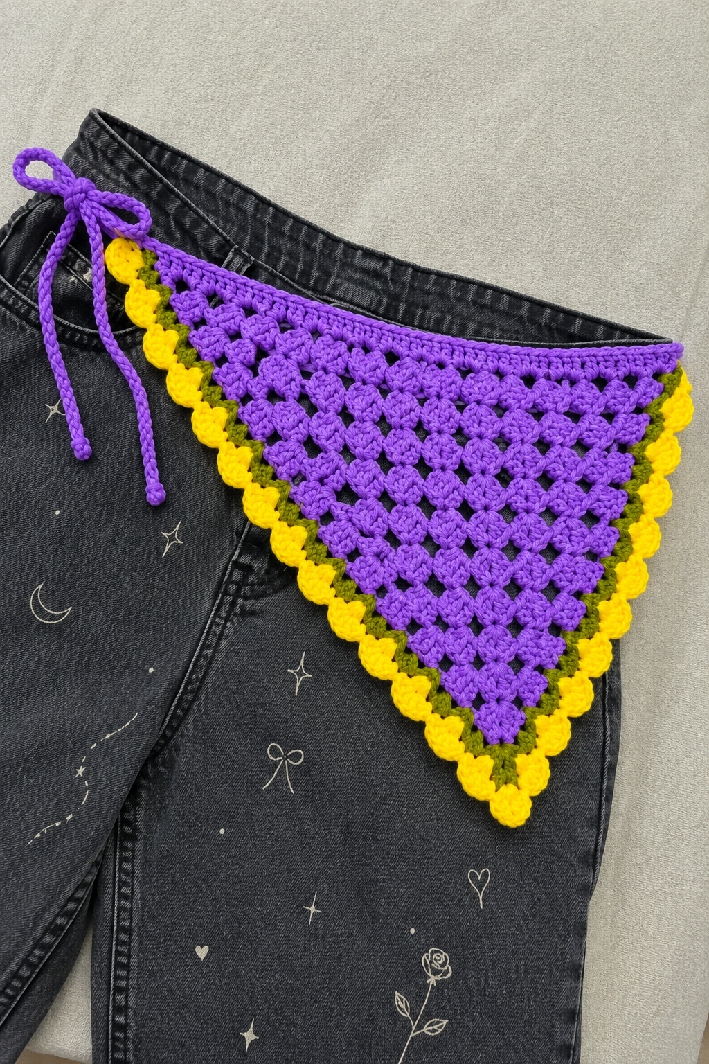 Women's crochet bandana styled on dark denim