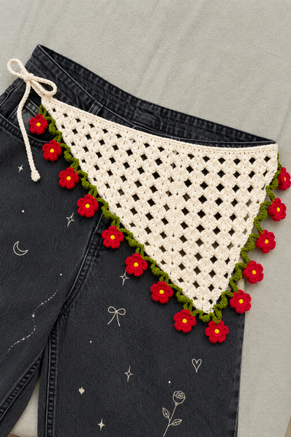 Crochet bandana on dark denim, product styling view