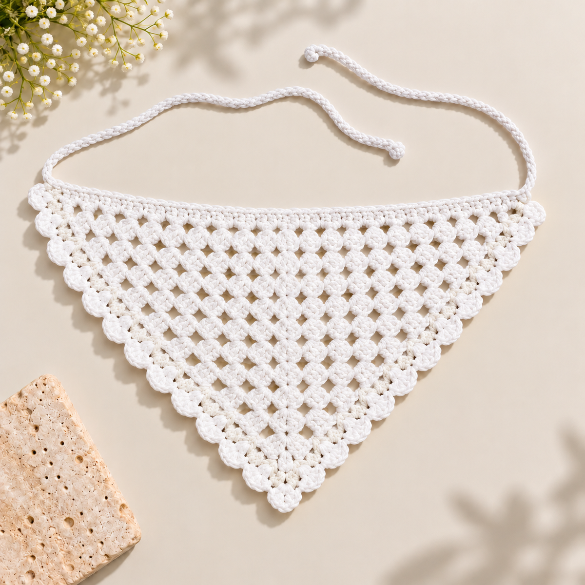 Crochet triangle bandana with tie-back straps, flat-lay product view