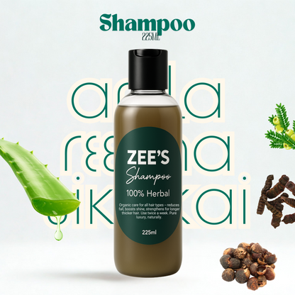 Zee's Shampoo bottle with aloe vera leaf, peppercorns, and other herbs on a light background