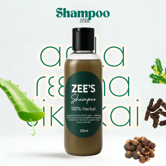 Zee's Shampoo bottle with aloe vera leaf, peppercorns, and other herbs on a light background